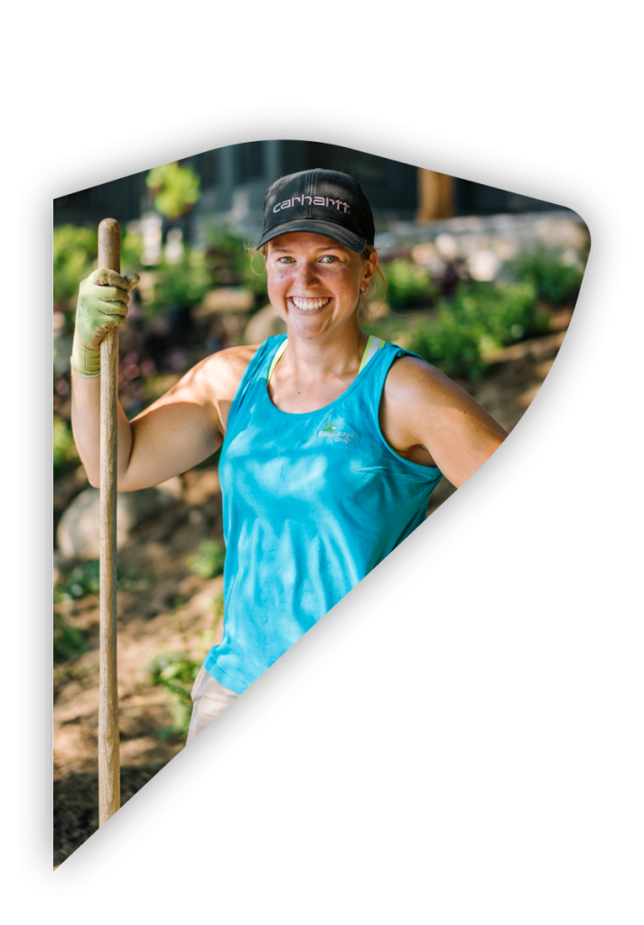worker smiling with shovel